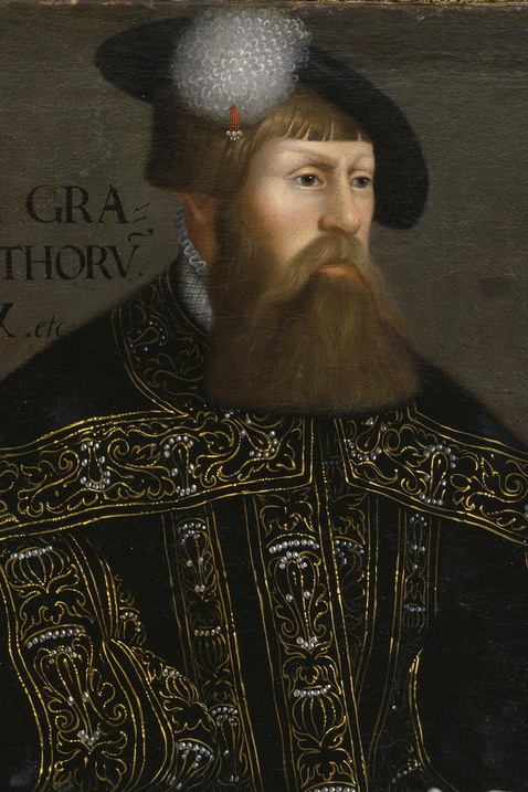 Närbild målning föreställande Gustav Vasa med mörkt hår, helskägg och hatt.