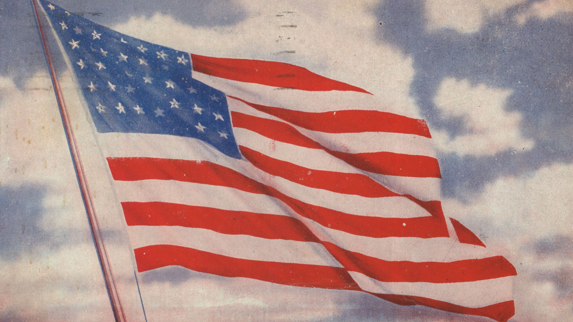 Målning av den amerikanska flaggan mot en blå himmel med vita moln.